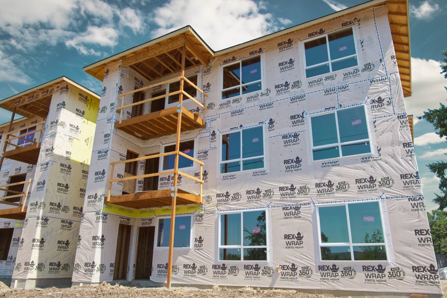 Exterior of multi-family complex under construction with Milgard windows installed