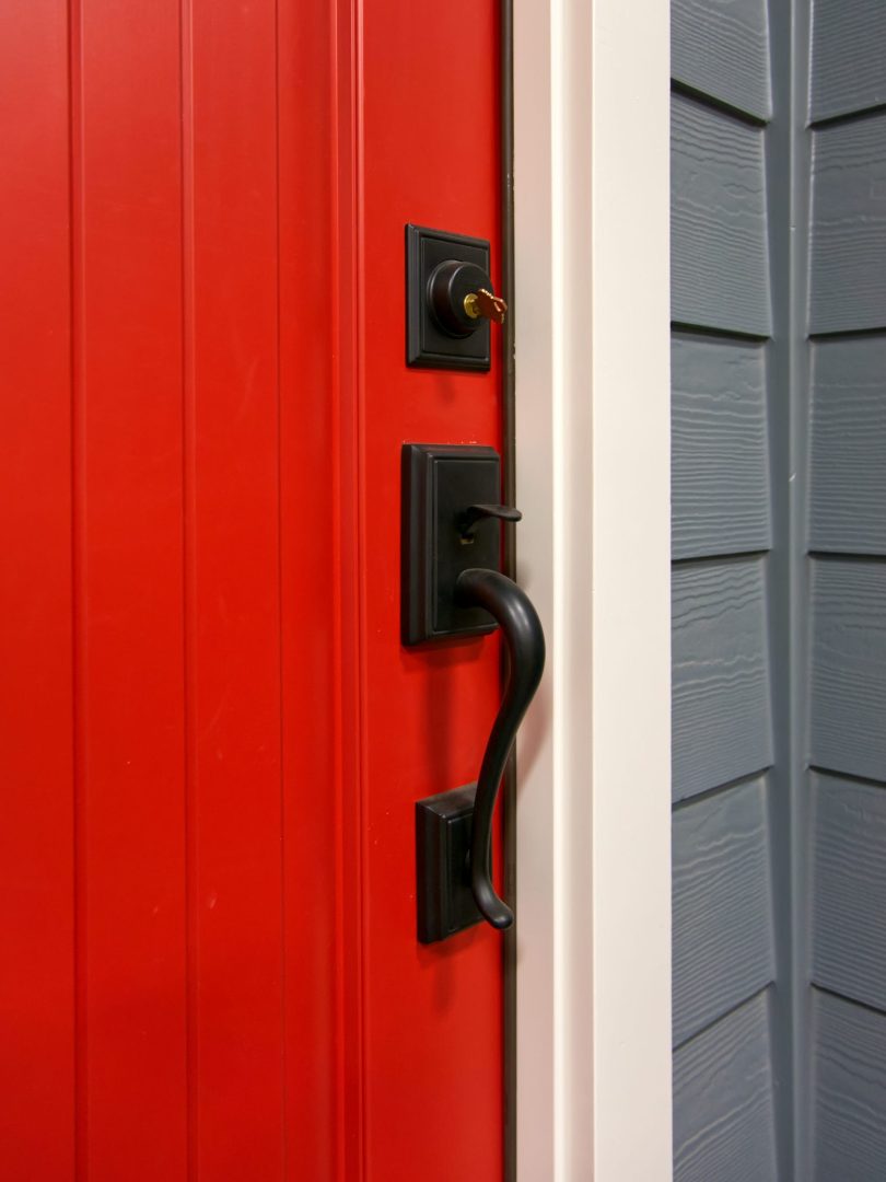 Close up of door hardware on red front door