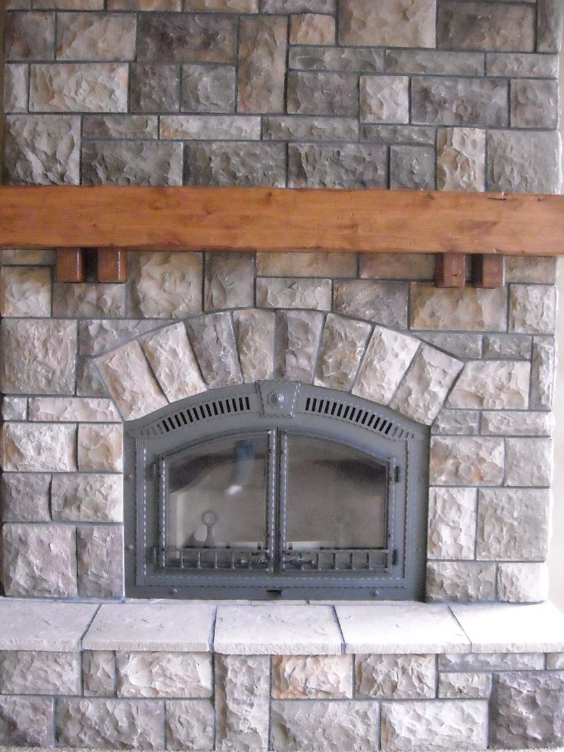 Fireplace with natural wood mantel